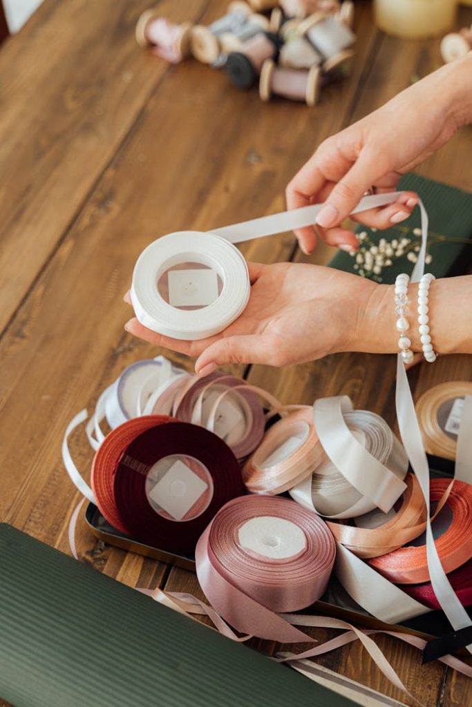 Person Holding White Plastic Measuring Cup